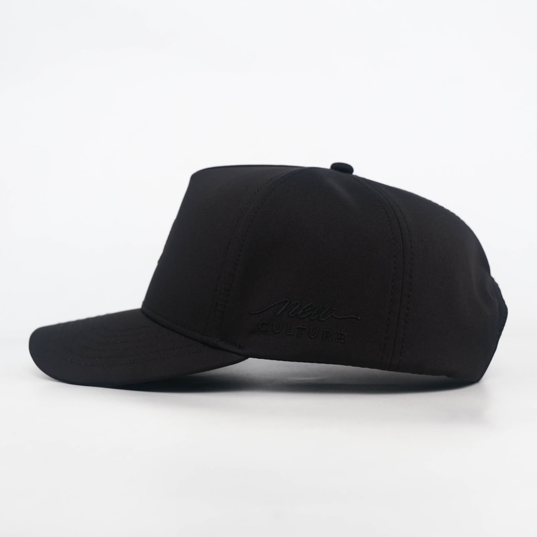 NOIR | DE LA VOL.001 black-on-black DL monogram detail